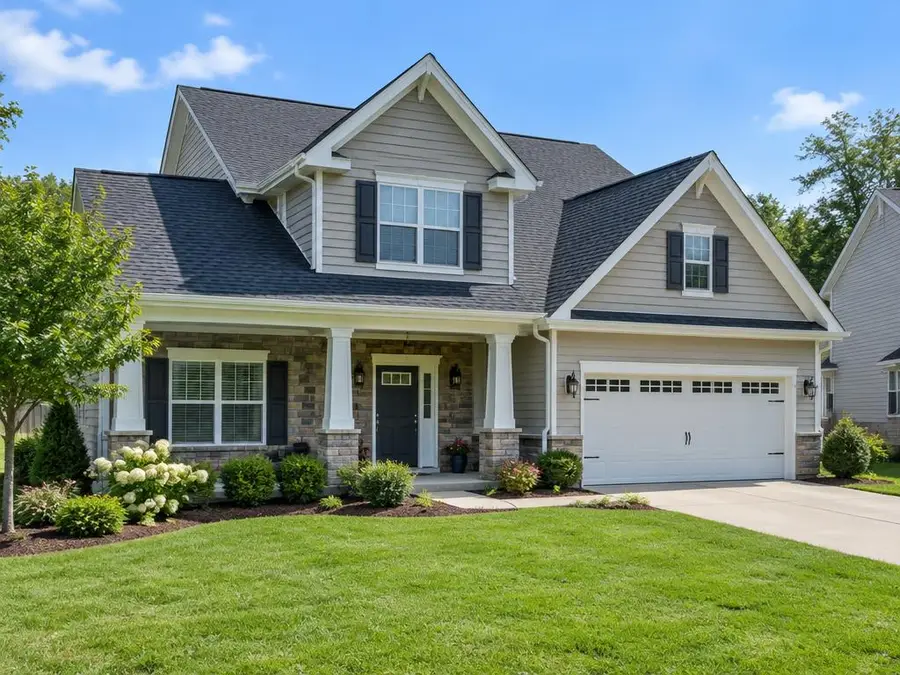 House with a freshly installed dark shingle roof